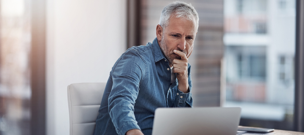 man at desk thinking