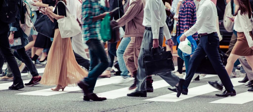 People walking across the crosswalk