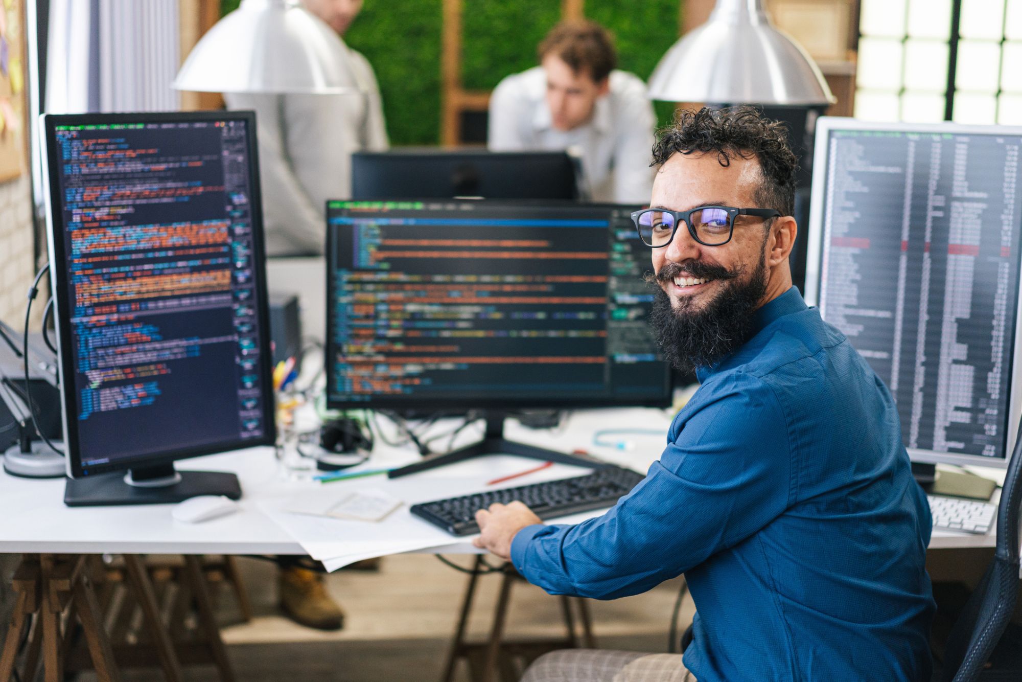 Technology professional working at computer at technology staffing firm